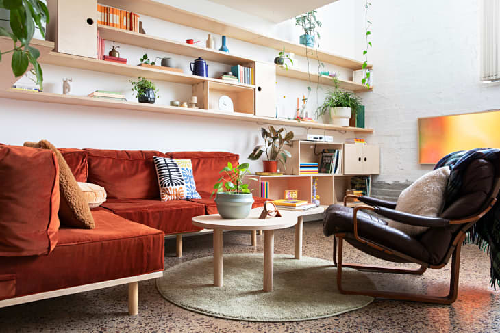View of See a Renovated Loft with Built-In Storage & Plywood Shelves ...